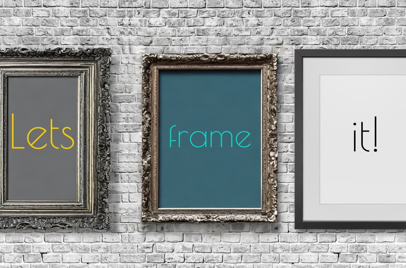 “Let’s frame it!” — three picture frames on a brick wall